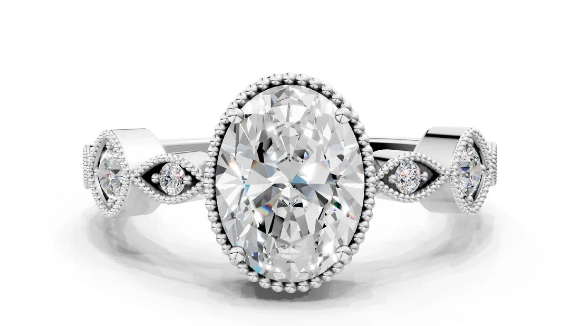 ⁣White gold Oval Cut Diamond Vintage Milgrain Ring with Round Stations
